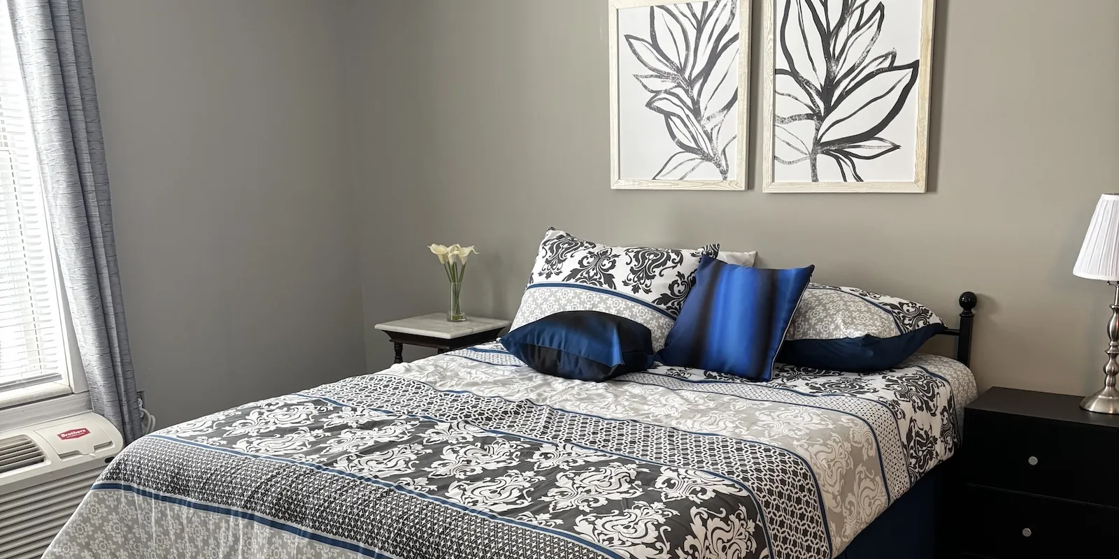 Evergreen Park model unit bedroom with bright natural light, newly remodeled.