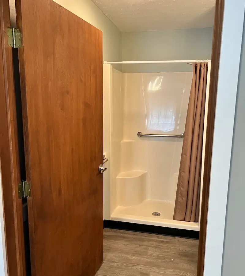 Recently-renovated bathroom with walk-in shower