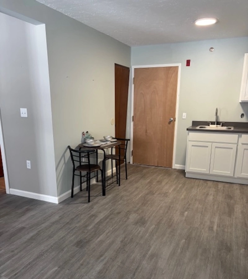 Evergreen Park model unit kitchen area with wood look easy care flooring